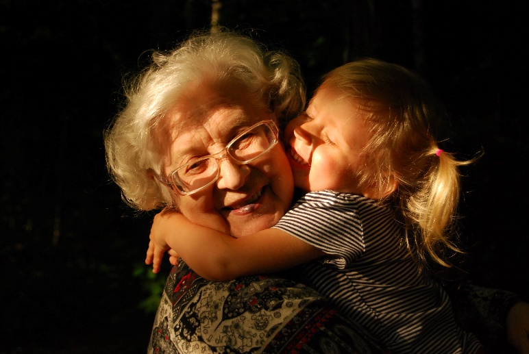 child kissing grandmother